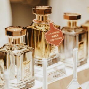 Elegant collection of perfume bottles showcasing luxury fragrances in a stylish retail display.