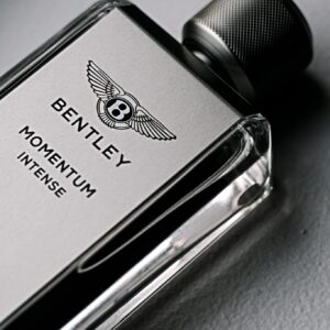 Elegant product shot of Bentley Momentum Intense cologne in a sleek bottle.