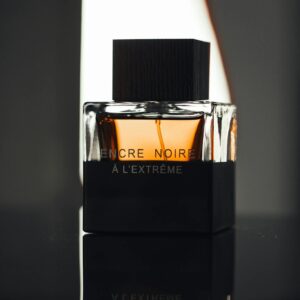 Sophisticated close-up of a luxury perfume bottle in a studio setting.